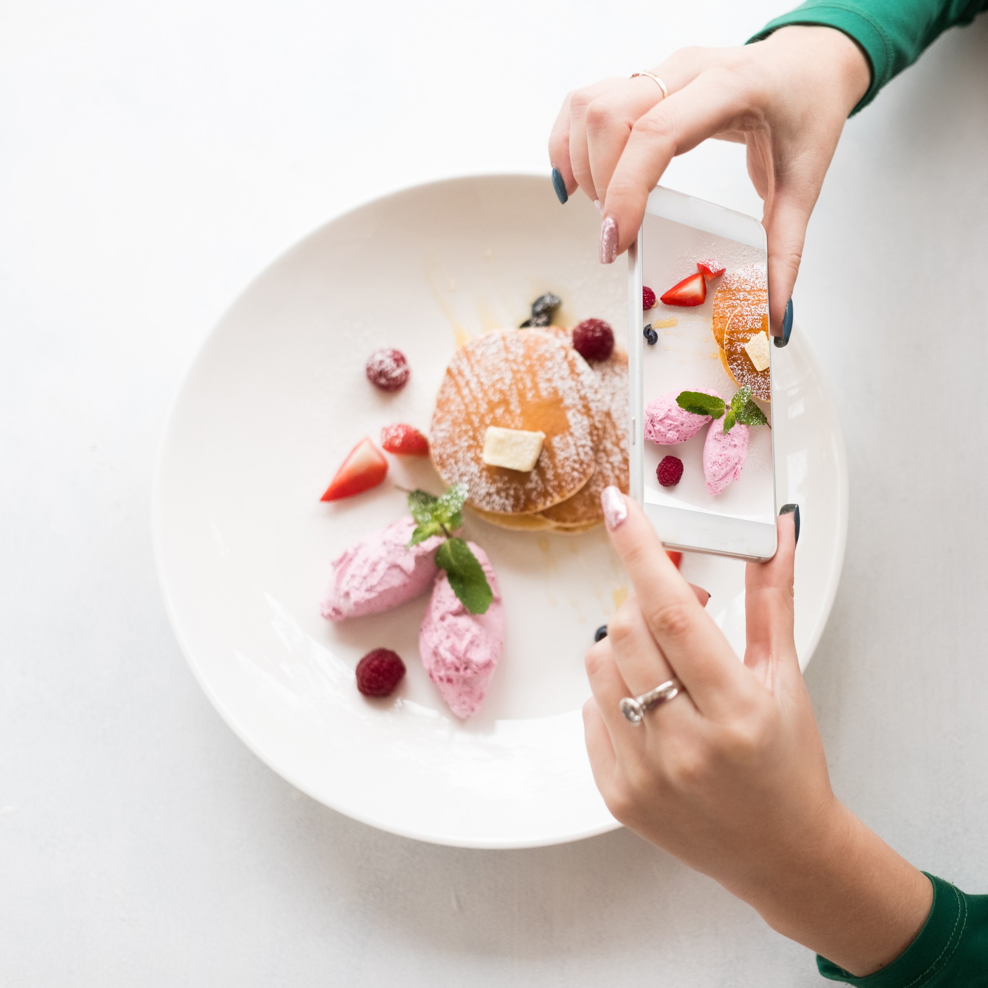Student plating a modern dessert